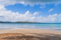 Luquillo beach in tropical Puerto Rico and white puffy clouds