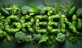 Lush arrangement of green vegetables and herbs creatively spelling GREEN, highlighting fresh produce, healthy eating, and Royalty Free Stock Photo