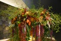 Lush autumn flower arrangement with physalis, asters, berries, leaves and ferny asparagus