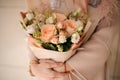 Lush bouquet of roses in peach wrapping Royalty Free Stock Photo