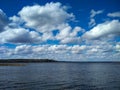 Lush clouds over the lake in sunny day Royalty Free Stock Photo