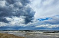 Lush cumulus clouds over Baltic sea in Jurmala, Latvia. Royalty Free Stock Photo