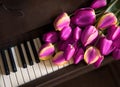 Tulips lie on the piano keys