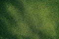 Lush green artificial grass texture with subtle shadows, providing a soft ground Royalty Free Stock Photo