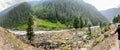 A Lush Green Hill With Cold Neelum River in Front Royalty Free Stock Photo