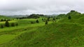 Lush green hills and valleys along Forgotten World Highway in New Zealand Royalty Free Stock Photo