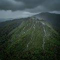 Lush Green Mountain Under a Rain Clouds Royalty Free Stock Photo