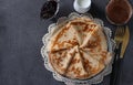 Lush homemade pancakes with wheat flour, eggs and yogurt, served with berries jam, milk and cup of coffee on gray Royalty Free Stock Photo