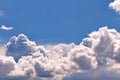 Lush massive white clouds against a clear blue sky