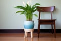 lush peace lily in a ceramic pot on a stool