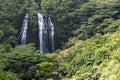 Lush tropical jungle landscape with tall waterfall on the island Royalty Free Stock Photo