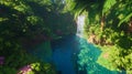 Lush tropical rainforest with waterfall and vibrant vegetation Royalty Free Stock Photo