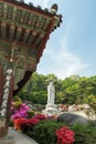 Lush vegetation and Buddha statue at the Bongeunsa Temple in Seoul Royalty Free Stock Photo
