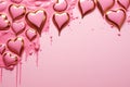 Lustrous pink and golden hearts dripping with pink paint on a pastel background, perfect for Valentine's Day