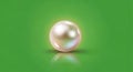 A lustrous spherical pearl is centered against a bright green background Royalty Free Stock Photo