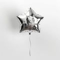 A lustrous star-shaped balloon with a sleek metallic finish captures Royalty Free Stock Photo