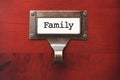 Lustrous Wooden Cabinet with Family File Label Royalty Free Stock Photo