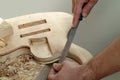Lute maker on work, detail of wood polishing