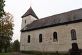 Lutheran church among the yellowing foliage on the trees in the small Latvian village of Cirava on October 9 2020