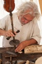 The luthier builds a medieval stringed instrument