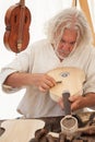 The luthier builds a medieval stringed instrument