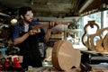 Guitar Luthier Examines Wood for Acoustic Guitar Neck