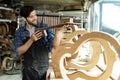 Guitar Luthier Examines Wood for Acoustic Guitar Neck