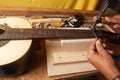 Luthier hands  making a classical guitar Royalty Free Stock Photo