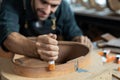 Luthier Inspects Kerfin Lining on Guitar Body