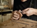 Luthier modifies the head of classical guitar. Royalty Free Stock Photo