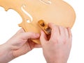 Luthier using small hand plane