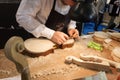 Luthier working on a violin at Bit 2014, international tourism exchange in Milan, Italy Royalty Free Stock Photo