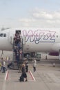 Passengers leaving Wizzair airplane after flight to Luton airport Royalty Free Stock Photo