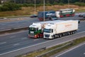 Eddei Stobart lorry and Sainsubrys lorry in motion on British motorway