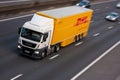 DHL lorry in motion on British motorway M1