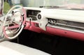 Pink retro Cadillac interior at classic car show