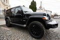 Lutsk, Ukraine - March, 2024: A high-end black Jeep Wrangler SUV showcasing its sleek design and rugged features, parked elegantly
