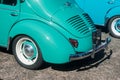 Rear view of blue retro Renault 4CV parked in the street