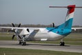 Luxair plane doing taxi on taxiway, back view