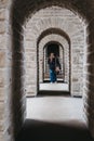 Woman walking through arcs in Bock Casemates in Luxembourg City