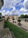 Luxembourg gardens and palace with puffy clouds in Paris, France Royalty Free Stock Photo