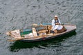 Luxor, Egypt - Jan 2019: Portrait of an old Egyptian fisherman on the Nile River in a traditional wooden boat