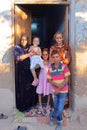 LUXOR, EGYPT - NOVEMBER 6, 2011: An Egyptian family posing at the entrance of her house in the village of Gabawi