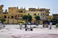 Luxor, Egypt - October 08 2021: Janitors clean up and sweep the street in Luxor near the temple of Karnak.