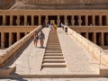 Luxor, Egypt - October 3, 2021: View of the main entrance of the temple of Queen Hatshepsut in the mountains of Egypt. People