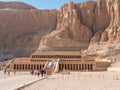 Luxor, Egypt - October 3, 2021: View of the temple of Queen Hatshepsut in the mountains of Egypt. People walk around the territory