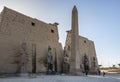 The colossal statues of Ramesses the Great and obelisk at the first pylon of Luxor Temple