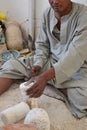 Production of hand-made egyptian onyx souvenirs by arabic man.