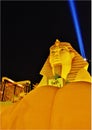 Luxor Las Vegas a replica of the Great Sphinx of Giza and a pyramid shaped building with a spotlight.