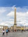The Luxor Obelisk at the center of the Place de la Concorde in Paris in a summer day with tourists Royalty Free Stock Photo